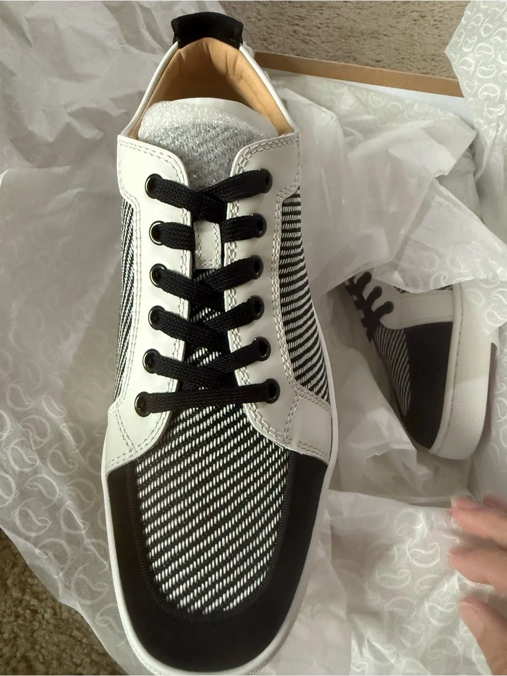 Christian Louboutin bought them